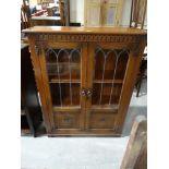 A Mid 20th Century Polished Oak Two Door Bookcase Cabinet
