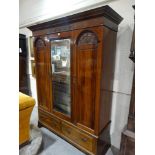 An Edwardian Mahogany Three Door Mirrored Wardrobe