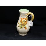 A Moulded Clarice Cliff Floral Decorated Jug, 8.5" High
