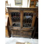 A Mid 20th Century Polished Oak Four Door Bookcase Cabinet