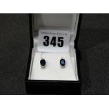 A Pair Of Silver & Sapphire Earrings