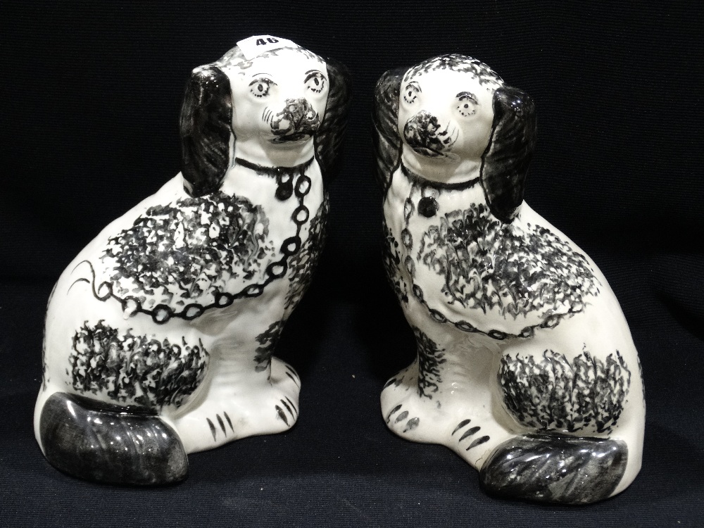 A Pair Of Staffordshire Pottery Black & White Sponge Ware Decorated Seated Dogs, 9" High