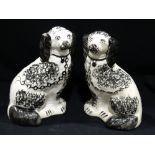 A Pair Of Staffordshire Pottery Black & White Sponge Ware Decorated Seated Dogs, 9" High