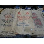 A Collection Of Vintage Farm Sacks, Some With Advertising Prints