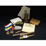 A Small Box Of Mixed Militaria Collectables To Include Shell Cases Etc