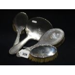 A Silver Backed Hand Mirror & Two Matching Brushes, Together With A Further Matched Brush