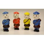 4x Carlton Ware Dunlop Style Caddie Golfing figures - various coloured hand painted glazed figures