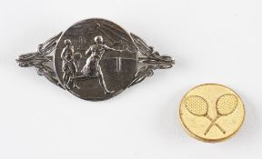 Silver Plated Tennis Brooch depicting two females playing tennis, a circular style brooch with pin