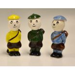 3x Carlton Ware Dunlop Style Caddie Golfing figures - various coloured hand painted glazed figures