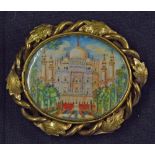 Indian Miniature Painting Brooch depicts Taj Mahal within decorative entwined floral pattern white