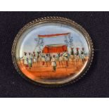 Indian Miniature Painting Brooch depicts a ceremonial scene, within decorative white metal frame,
