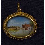 Indian Miniature Painting Brooch depicts a view of the Red Fort in Delhi, within decorative yellow