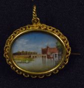 Indian Miniature Painting Brooch depicts a view of the Red Fort in Delhi, within decorative yellow