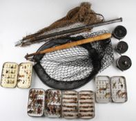 Collection of various trout fly reels and alloy fly tins with both salmon and trout flies and 2x