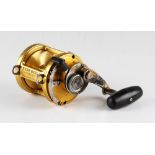 Penn International II 12 LT Big Game Fishing Reel in gold, lever drag, marked I960290, made in U.S.A