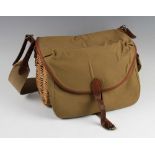 Fine Brady wicker trout size creel - unused with canvas and leather top and front with water proof