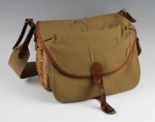 Fine Brady wicker trout size creel - unused with canvas and leather top and front with water proof