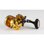Penn International TRQ 200X Torque Multiplier Fishing Reel finished in gold, anodised, machined