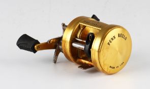 Penn International 955 Baitcast Fishing Reel finished in gold, made in U.S.A, soft grip handles,
