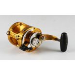 Penn International II 16 S Big Game Fishing Reel in gold, lever drag, marked I990580, made in U.S.