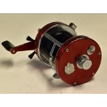 ABU Ambassadeur 7000 Multiplier Fishing Reel in red with chrome frame, marked 741100, counter
