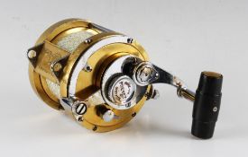 Penn International 50 Big Game Fishing Reel in gold, lever drag with ratchet, some scratches to