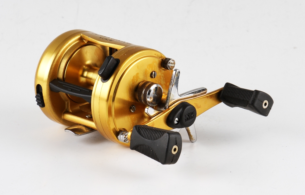Penn International 955 Baitcast Fishing Reel finished in gold, made in U.S.A, soft grip handles, - Image 2 of 2