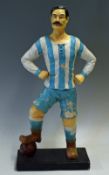 Early 20th century bisque football figure 20 inches high having not visible damage only having paint