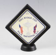 1983 Ryder Cup official golf bag tag - PGA National Golf Club mounted in an open floating frame 11 x