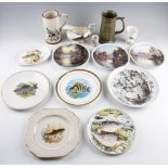 Mixed collection of fishing related china: Glass paperweights, studio pottery tankard, various