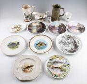 Mixed collection of fishing related china: Glass paperweights, studio pottery tankard, various