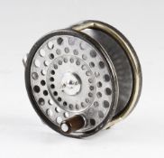 The Zenith Trout reel: 3. 3/8" dia. With two screw drum release latch, smooth alloy ribbed foot,