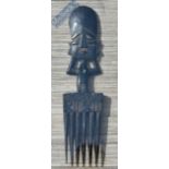 African Wooden Comb - African face having a 6-prong comb mounted in a glazed display frame 46 x