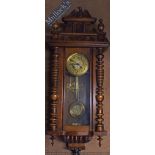 ‘Dom Goug’ Walnut Cased Wall Clock measures 100x36x20cm approx.