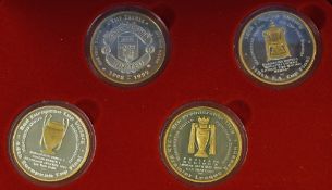 Presentation set of 4 medals commemorating the Manchester United achievement of the Treble in 1998/