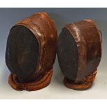 2x Early 20th Century Leather Fencing Head Guards with padded seal to bottom front, with a brown