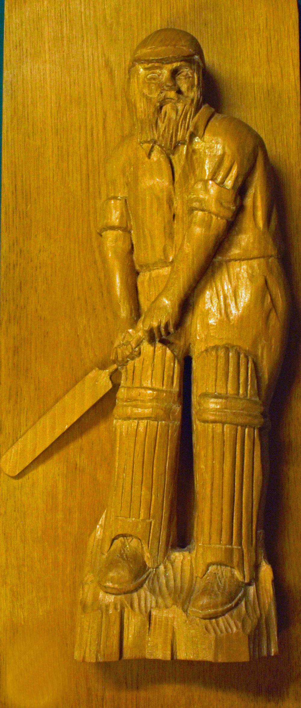 W G Grace wooden Cricket carved plaque Mounted on green backed board, plaque size 53 x 23cm