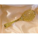 Modern Tennis Brooch in gold gilt a single tennis racket with jewelled tennis ball, has pin to