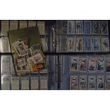 Selection of cigarette cards (2 albums) full of part sets to include Wills and Players with ‘Arms of