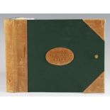 Fisherman’s Journal sketch pad: half leather and green cloth boards c/w button strap fastener -