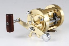 Shimano Calcutta 700 sea multiplier reel, gold anodised finish, power crank handle with star drag,