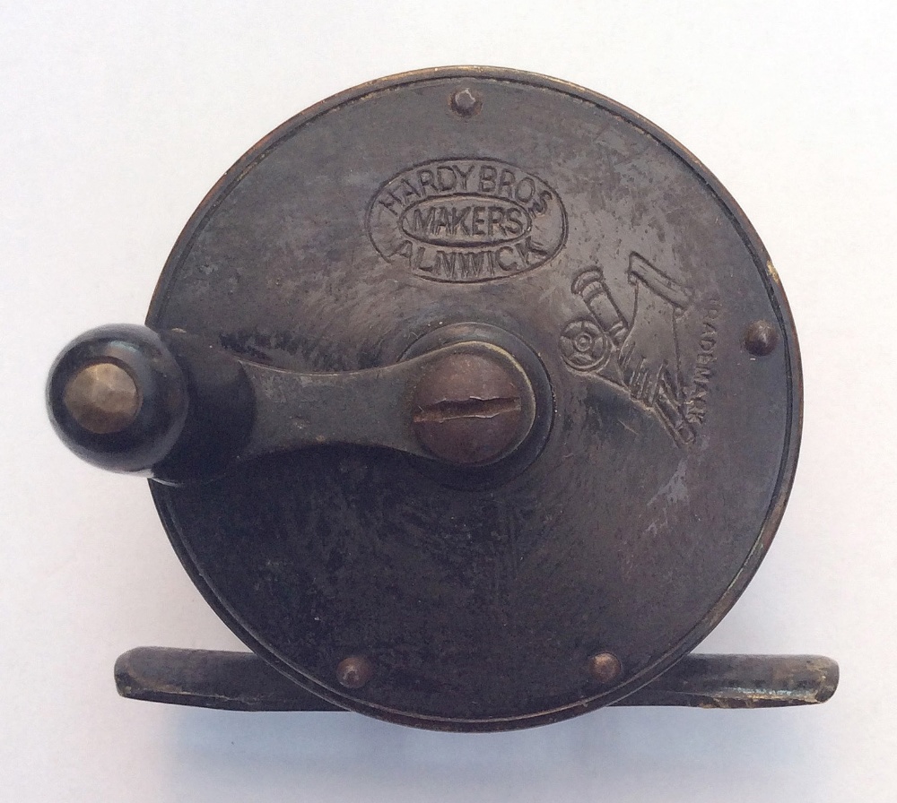 Scarce smallest catalogued Hardy Bros Alnwick brass crank wind reel: 2 1/4” dia, with Rod In Hand
