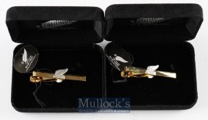 Two official NZ All Blacks merchandise tie clips with gold metal and silver fern badge central, in