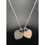 TIFFANY & CO. SILVER MINI DOUBLE HEART TAG PENDANT ON CHAIN one heart with pink enamel, the other