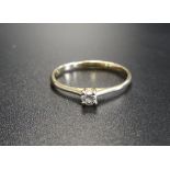 DELICATE DIAMOND SOLITAIRE RING on fourteen carat gold shank, ring size J-K