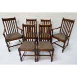 SET OF SIX OAK DINING CHAIRS early 20th century, including two carvers with outswept arms, all