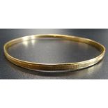 TWENTY-ONE CARAT GOLD BANGLE marked 875, approximately 8.7 grams