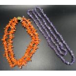 TWO BEAD NECKLACES comprising an amethyst example and a double strand coral necklace (2)