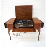 MAHOGANY AND CROSSBANDED HI-FI CABINET with a lift up lid revealing a Dynatron music centre with a