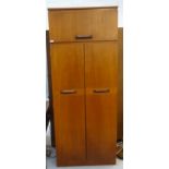 SAKOL TEAK WARDROBE the moulded square top above a lift up cupboard door with a pair of full